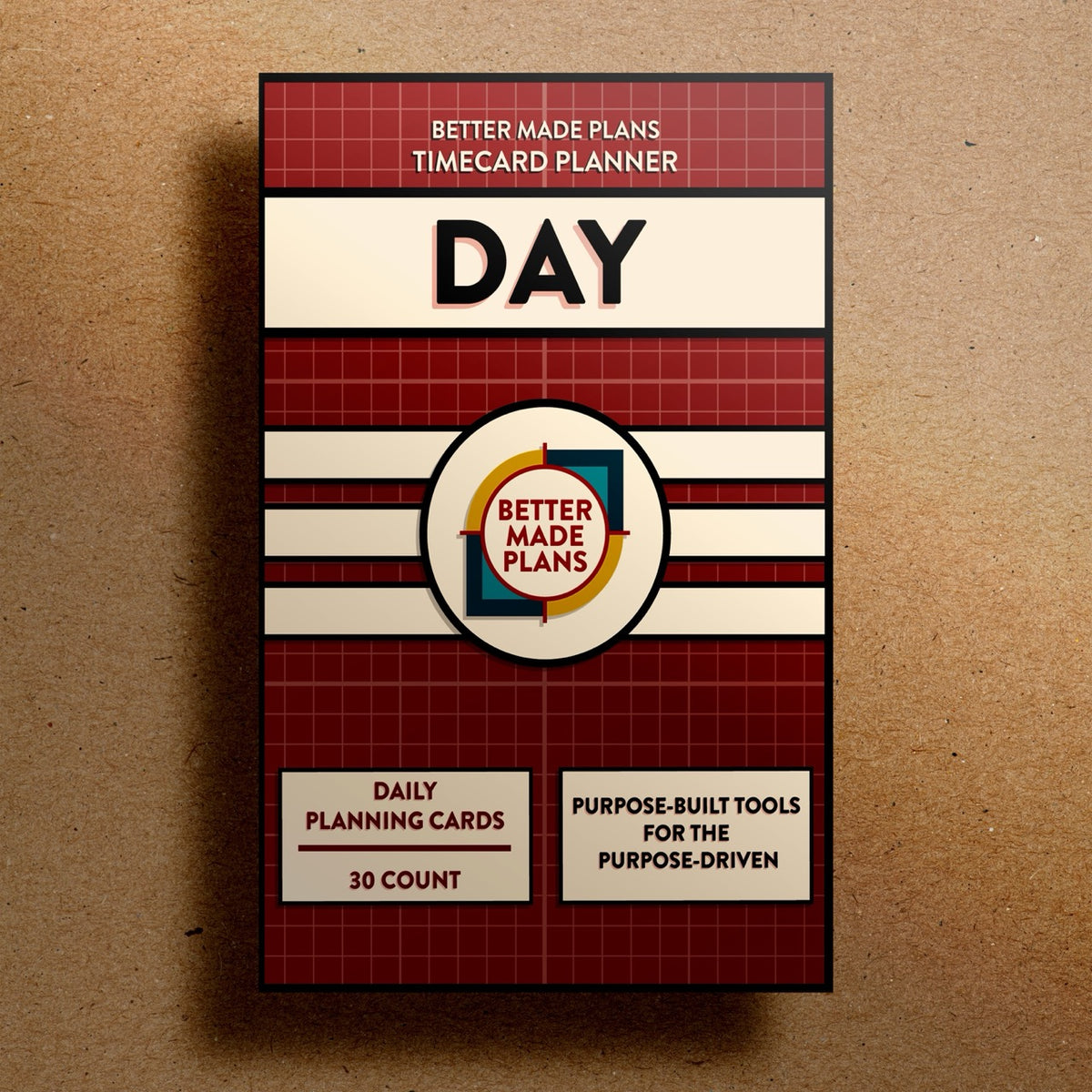 Better Made Plans Timecard Series Day Edition planner packaging on a brown background.