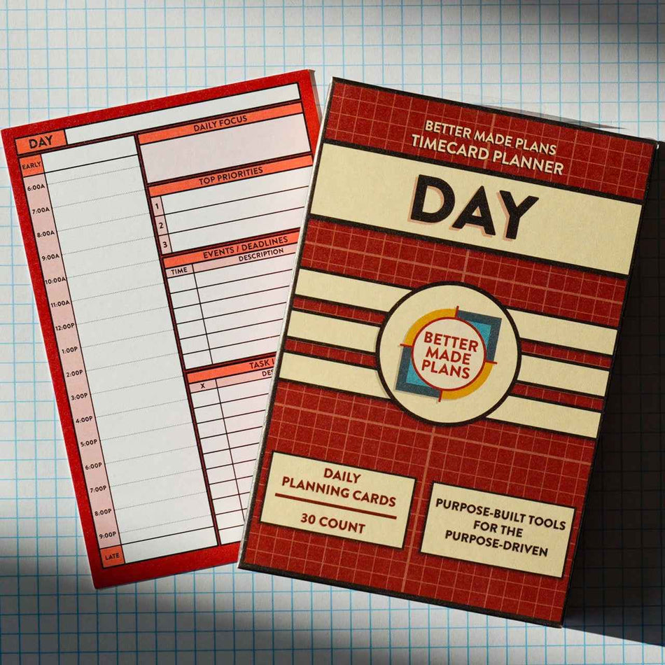 Better Made Plans Day Planner planning card with packaging on grid background
