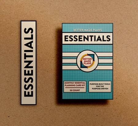 Packaging for Better Made Plans Essentials planning kit on brown paper background with black and white label saying "Essentials."