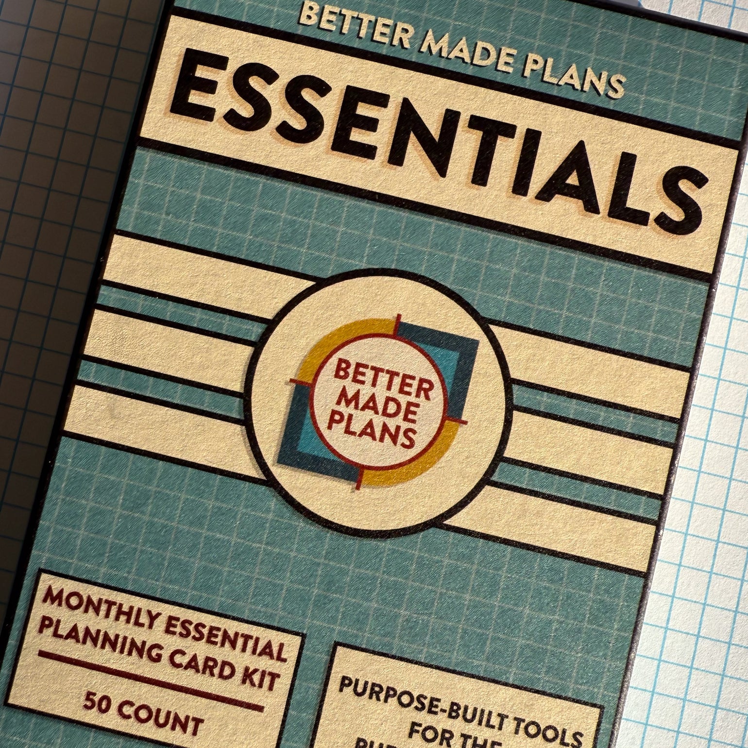 Packaging for Better Made Plans Essentials Series Planning Kit on a graph paper background.