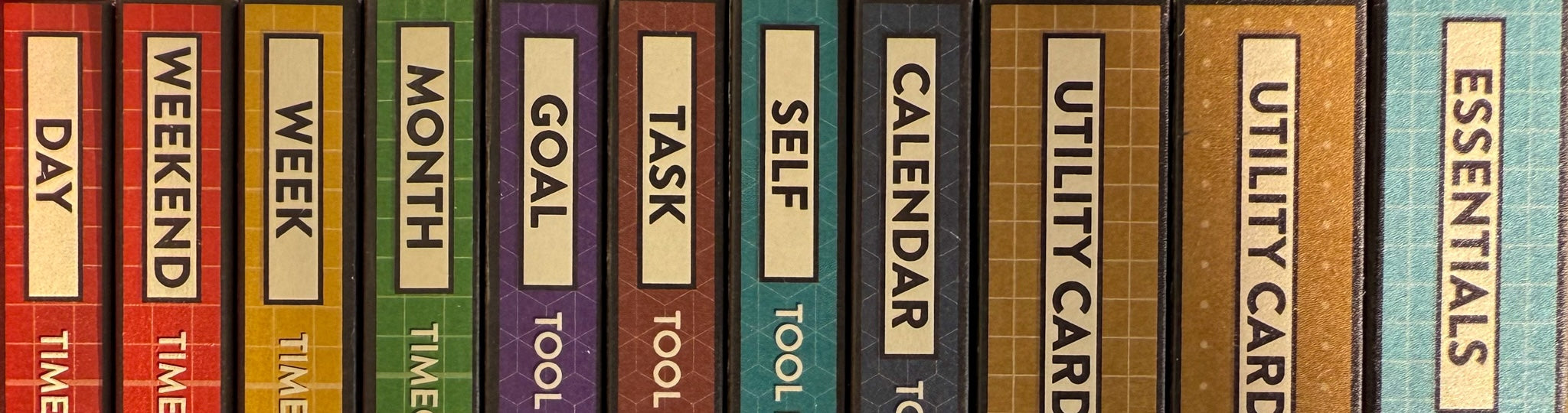 Colorful spines of Better Made Plans planning card packages.