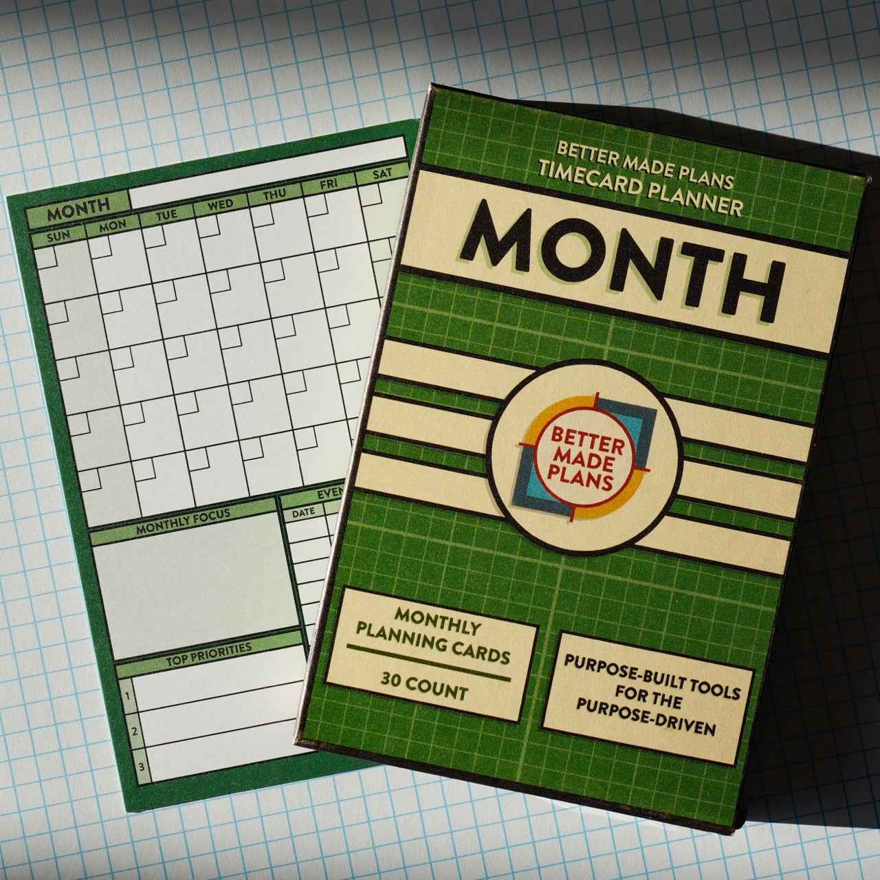 Better Made Plans Month Planner planning card with packaging on grid background