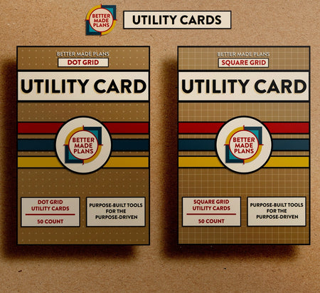 Front of Better Made Plans Utility Card Series Dot Grid and Square Grid packages on kraft paper background.