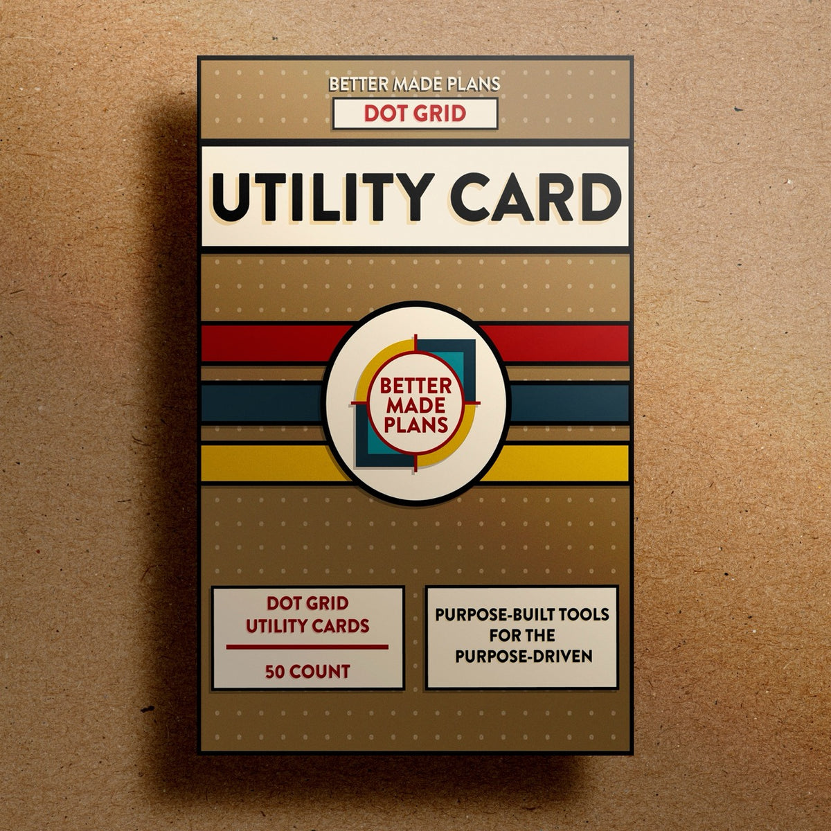 Better Made Plans Utility Card Series Dot Grid Edition planner packaging on a brown background.