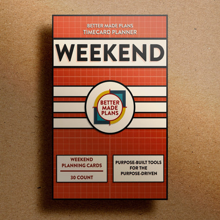 Better Made Plans Timecard Series Weekend Edition planner packaging on a brown background.